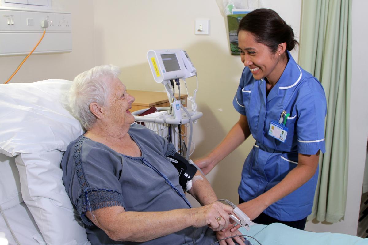 patient and nurse laughing