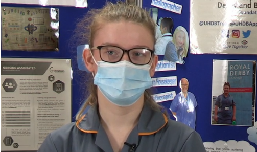 A clinical apprentice with a surgical mask on